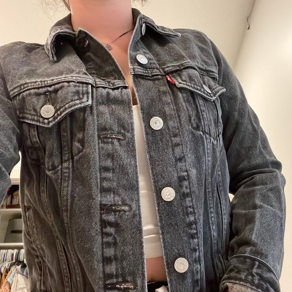 Black Levi’s jean jacket. I outgrew it so my loss is your gain.